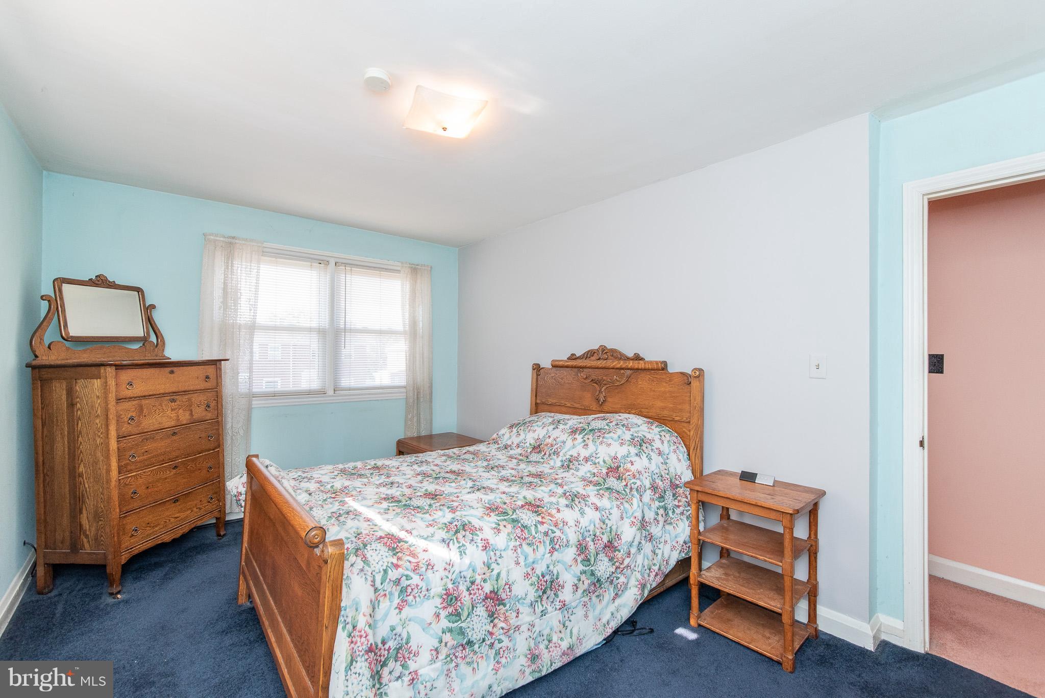 49 Hawthorne Road Baltimore, MD 21220 - Photo 19 of 31 a bedroom with a bed and wooden floor