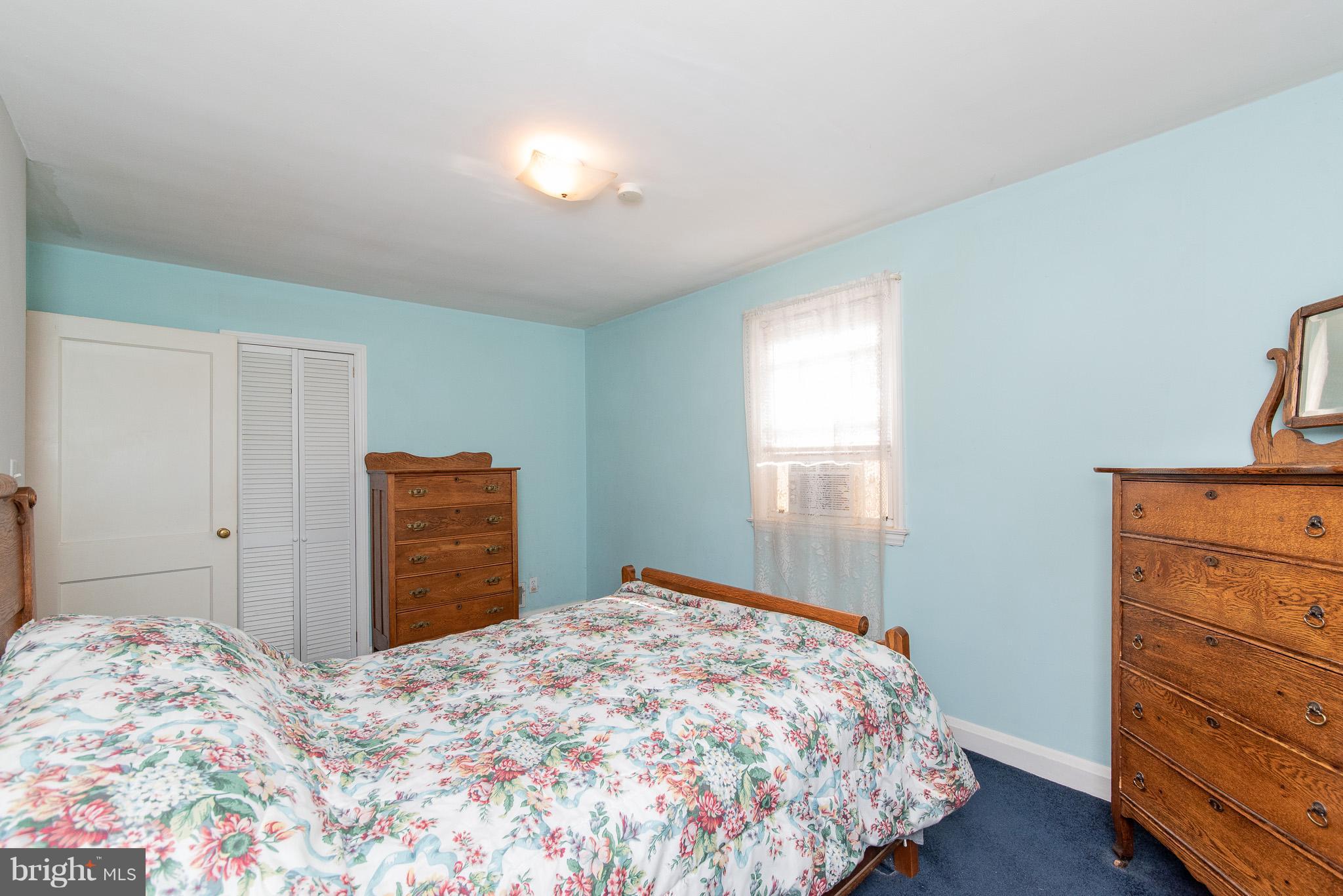 49 Hawthorne Road Baltimore, MD 21220 - Photo 20 of 31 a bedroom with a bed and a dresser