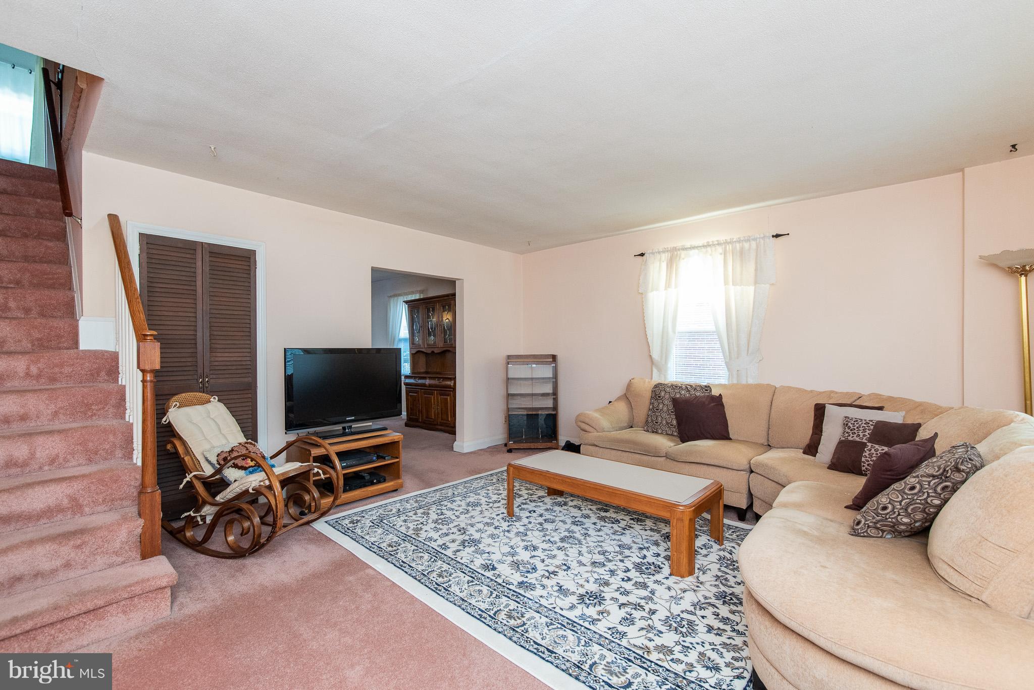49 Hawthorne Road Baltimore, MD 21220 - Photo 3 of 31 a living room with furniture and a flat screen tv