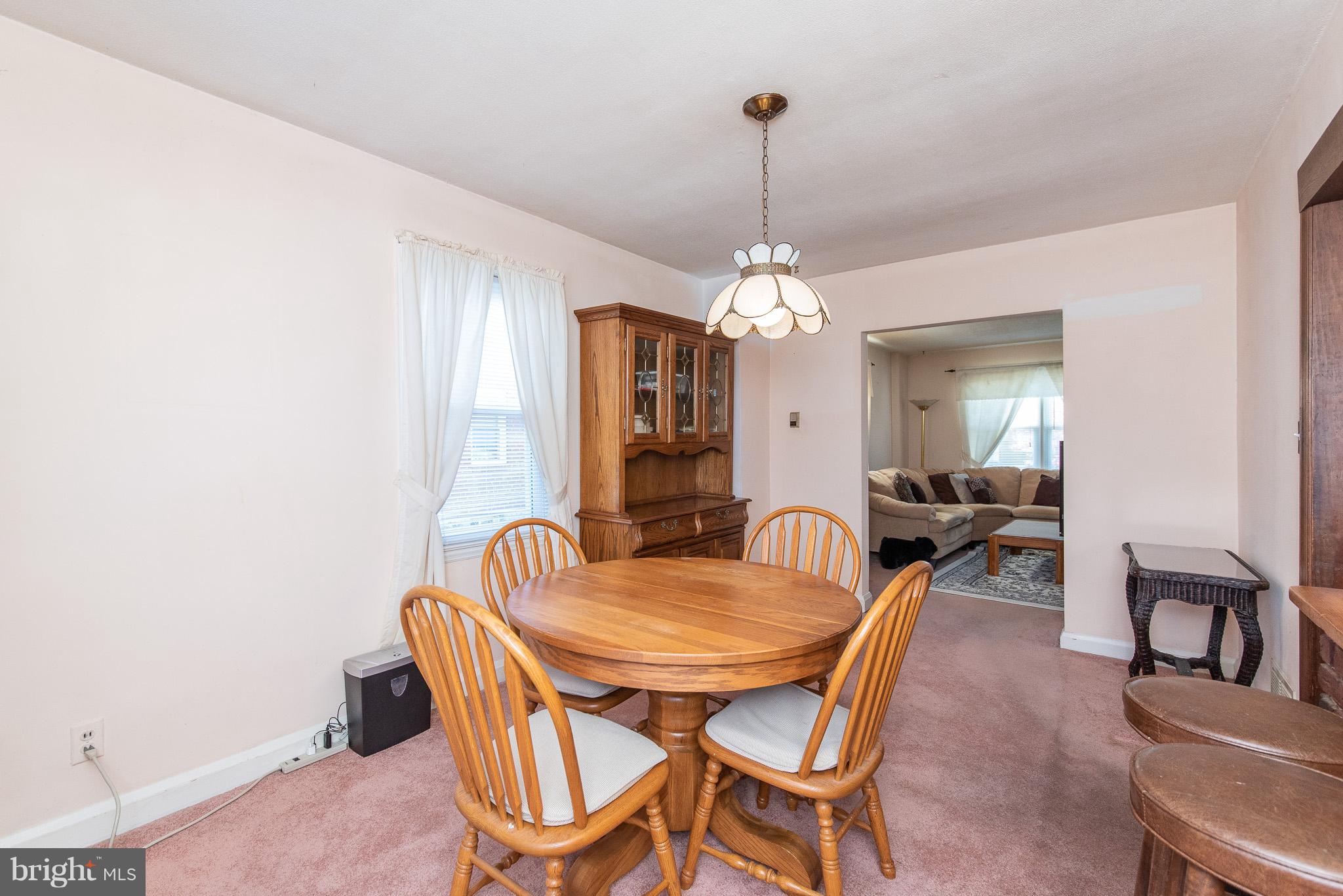 49 Hawthorne Road Baltimore, MD 21220 - Photo 8 of 31 a view of a dining room with furniture and chandelier