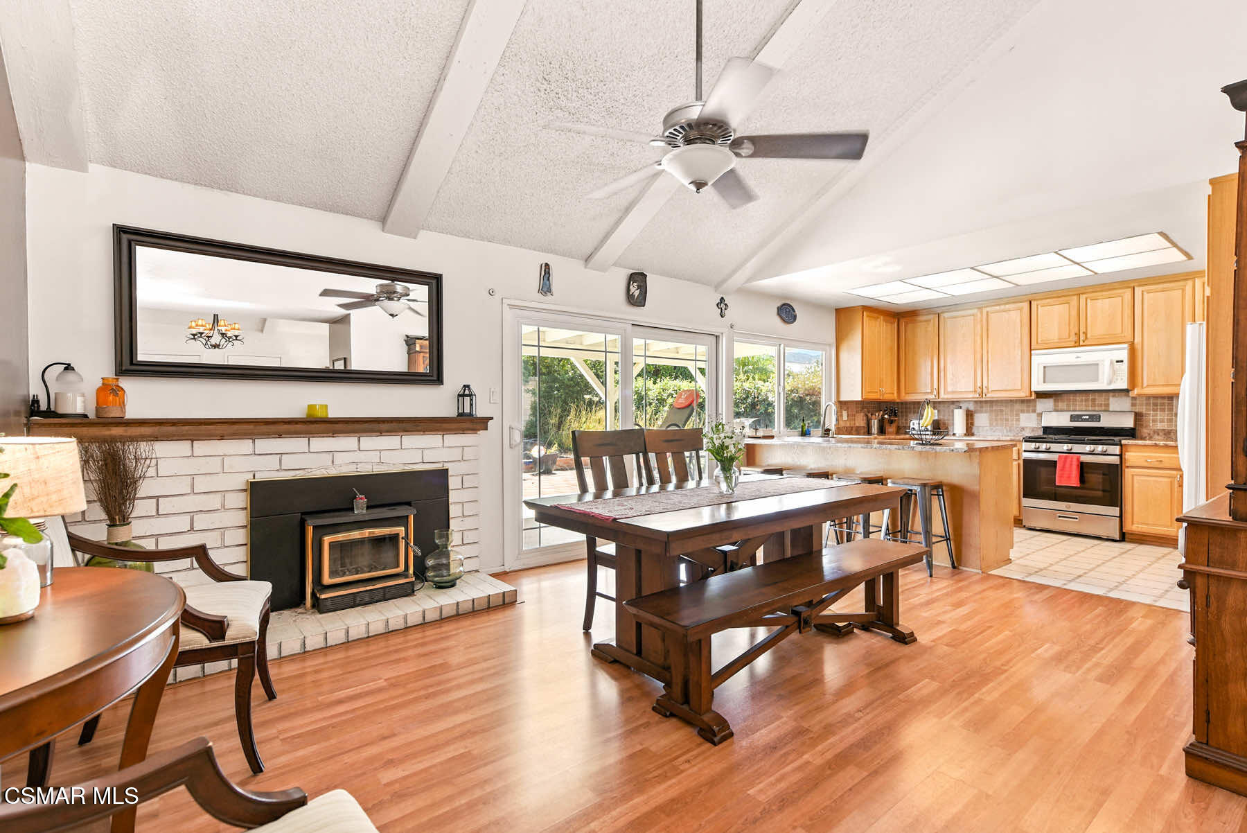 2238 Connell Avenue Simi Valley, CA 93063 - Photo 1 of 26 a living room with furniture a fireplace and kitchen view