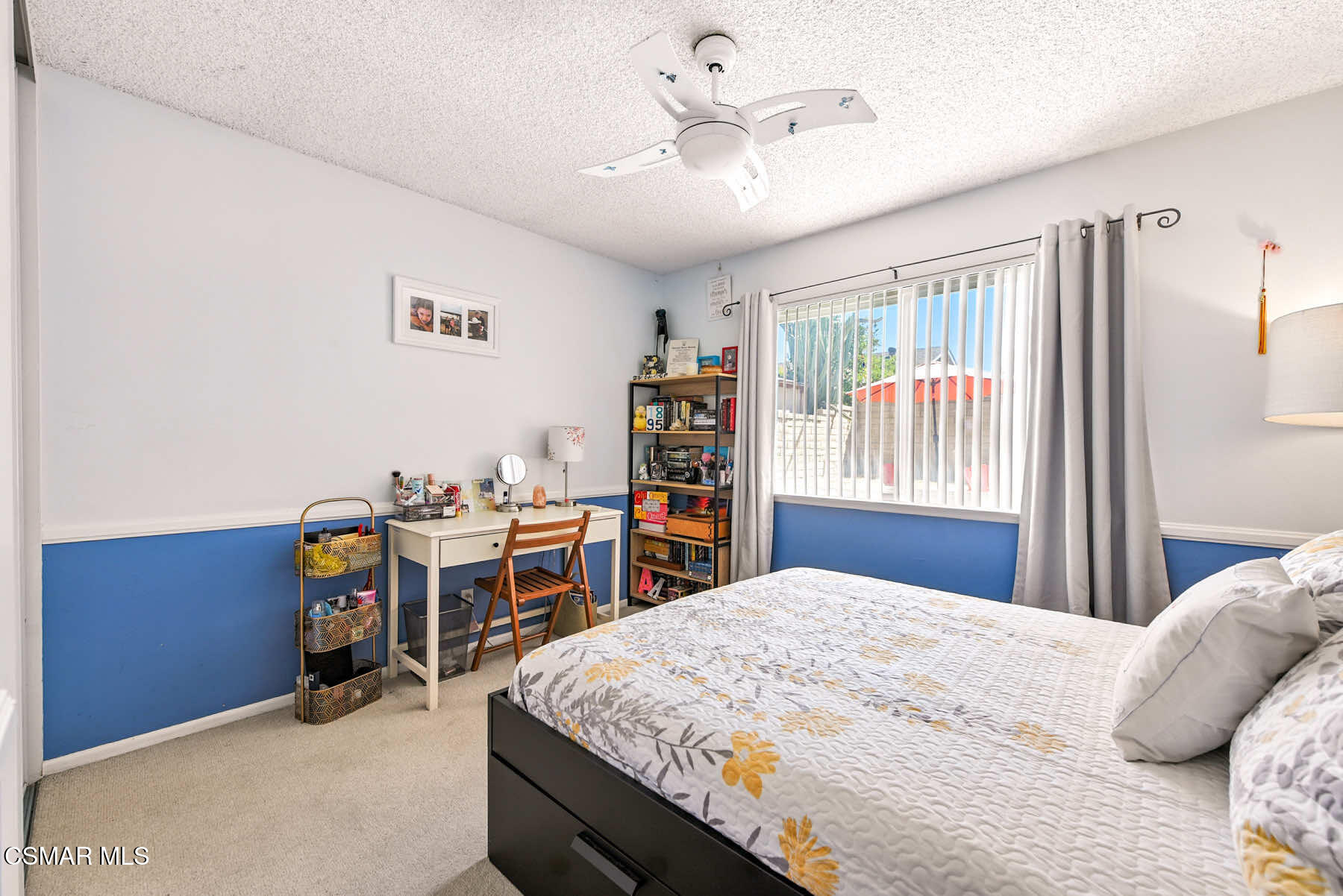 2238 Connell Avenue Simi Valley, CA 93063 - Photo 14 of 26 a bedroom with a large bed and a chandelier