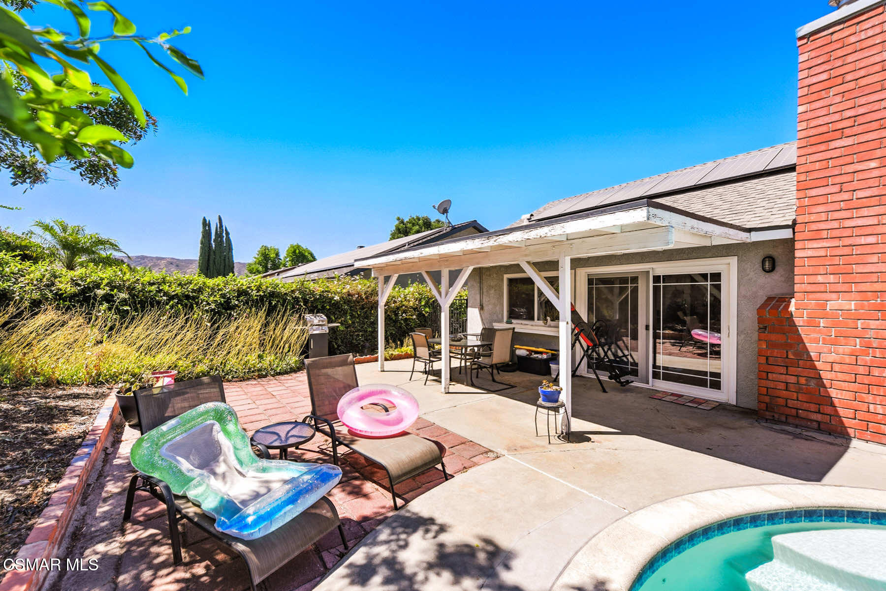 2238 Connell Avenue Simi Valley, CA 93063 - Photo 22 of 26 a view of a patio with table and chairs potted plants and palm tree