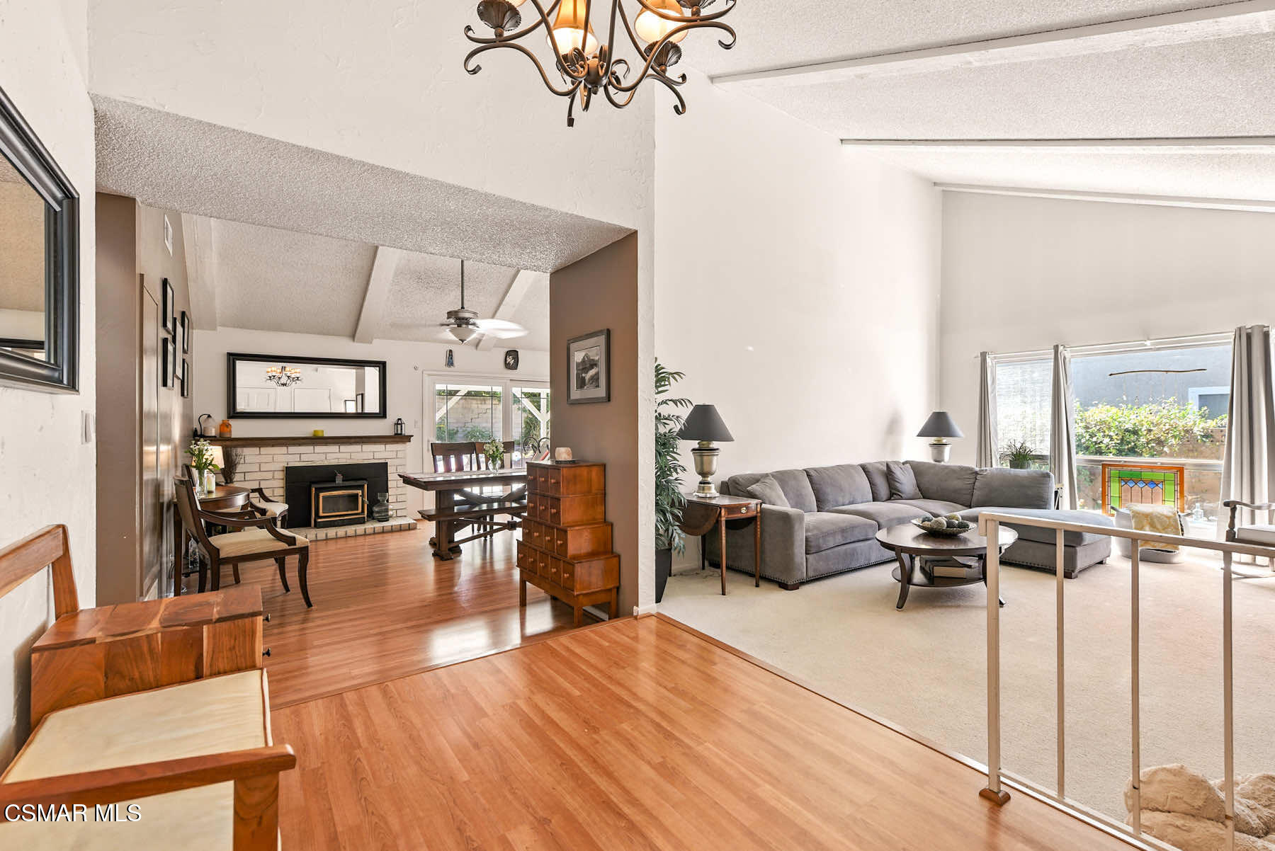 2238 Connell Avenue Simi Valley, CA 93063 - Photo 5 of 26 a living room with furniture a chandelier and a floor to ceiling window