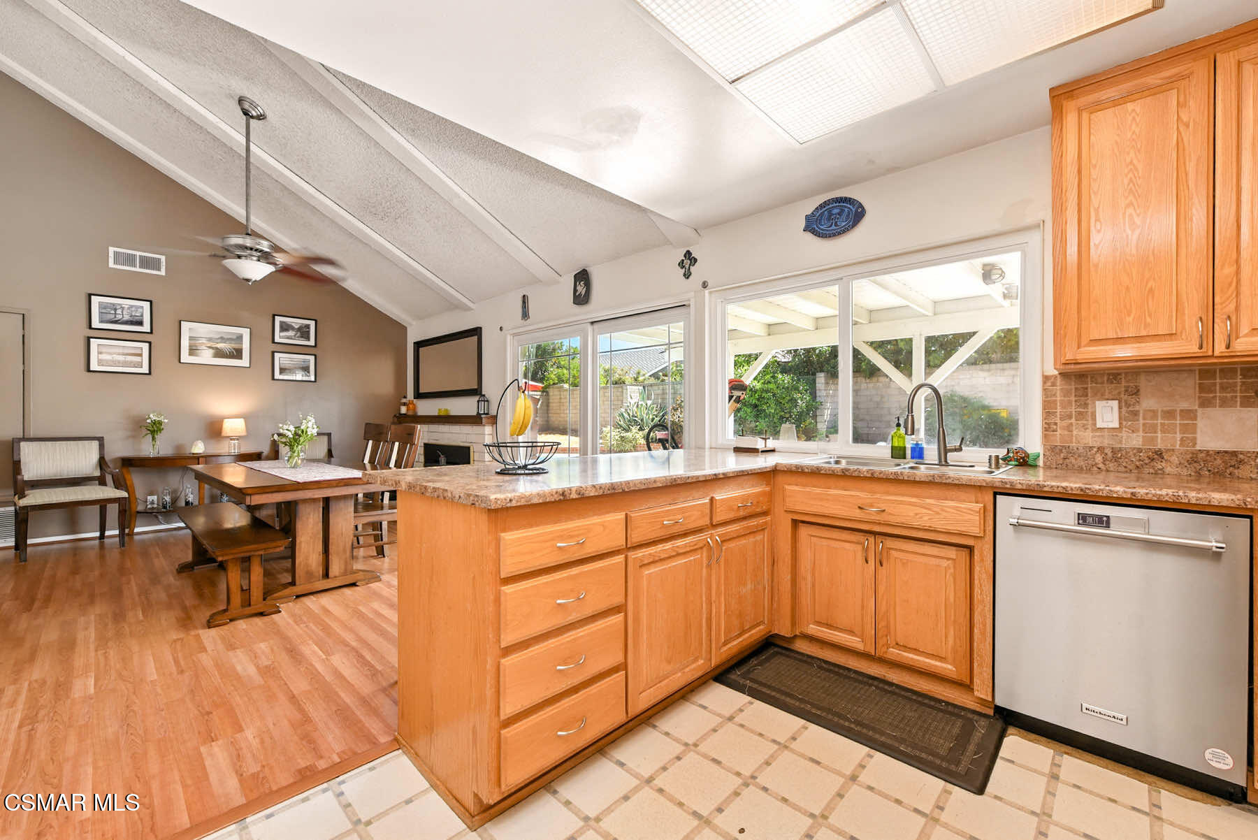 2238 Connell Avenue Simi Valley, CA 93063 - Photo 8 of 26 a open kitchen with stainless steel appliances granite countertop a stove top oven a sink dishwasher and cabinets with wooden floor