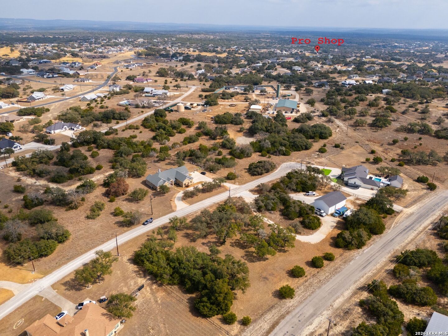 116 Riley Wood Blanco, TX 78606 - Photo 4 of 8 an aerial view of residential houses with outdoor space