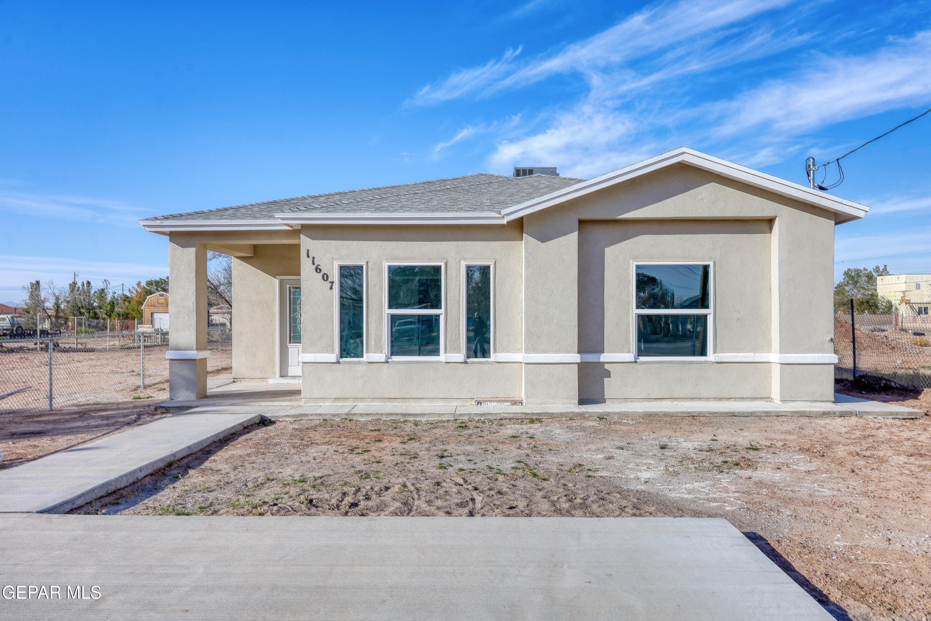11607 Valle Bonito Road Socorro, TX 79927 - Photo 1 of 29 a house with trees in the background