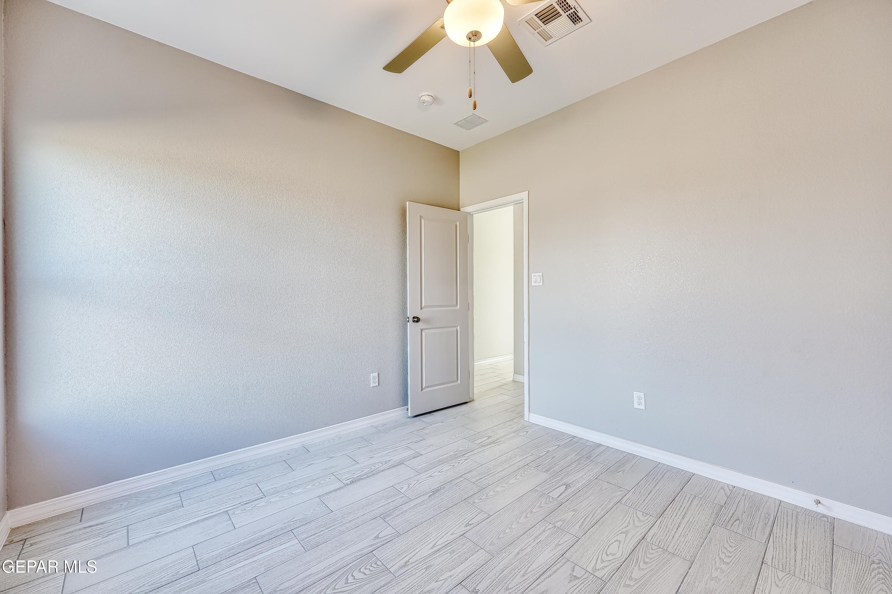 11607 Valle Bonito Road Socorro, TX 79927 - Photo 21 of 29 wooden floor in an empty room
