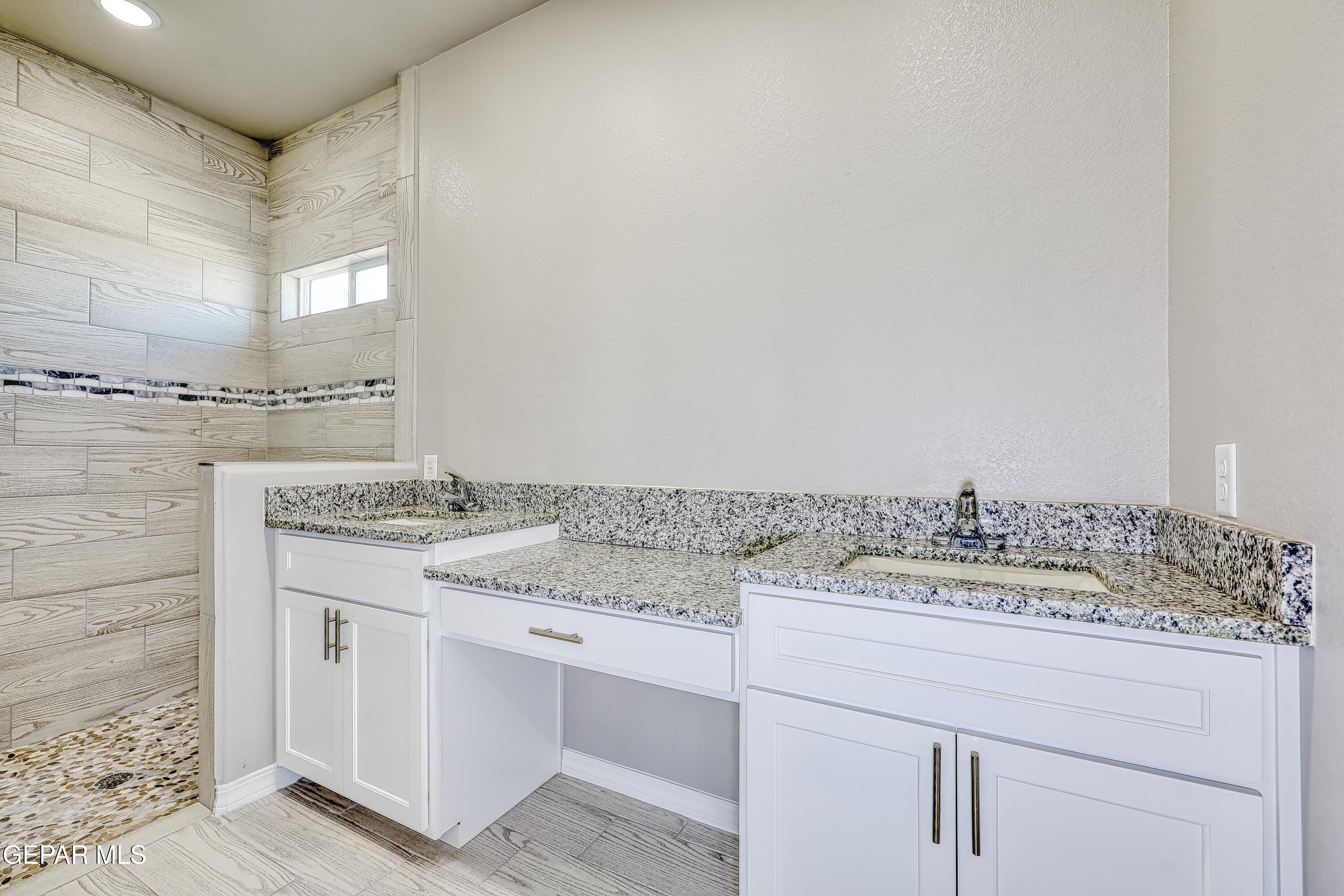 11607 Valle Bonito Road Socorro, TX 79927 - Photo 25 of 29 a bathroom with a sink and a mirror