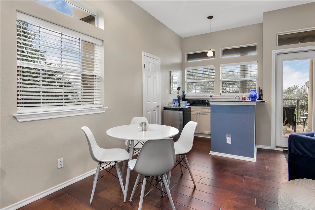2918 Ranch Road 620 North, Unit W222 Austin, TX 78734 - Photo 12 of 30 a view of a dining room with furniture window and wooden floor