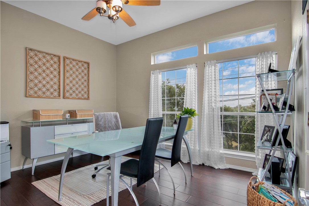 2918 Ranch Road 620 North, Unit W222 Austin, TX 78734 - Photo 13 of 30 a view of a dining room with furniture window and wooden floor