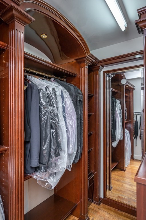 18 Fox Hill Road Newton, MA 02459 - Photo 21 of 37 a view of walk in closet with clothes and shoes