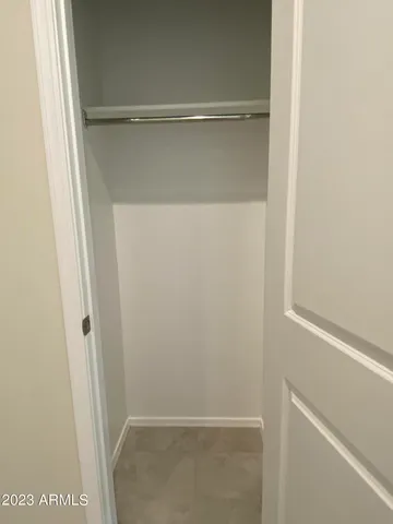 an empty room with closet area