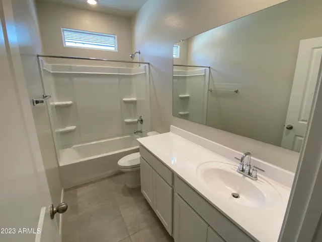 a bathroom with a bathtub and a toilet