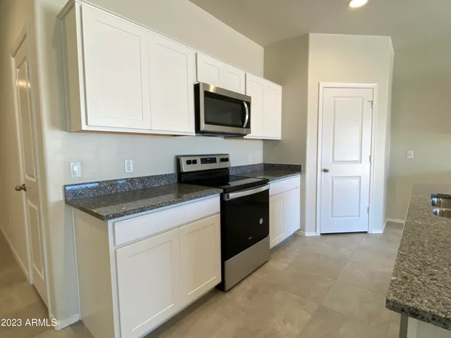 a kitchen with a stove and a microwave