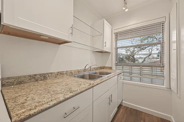 a kitchen with a sink and large window