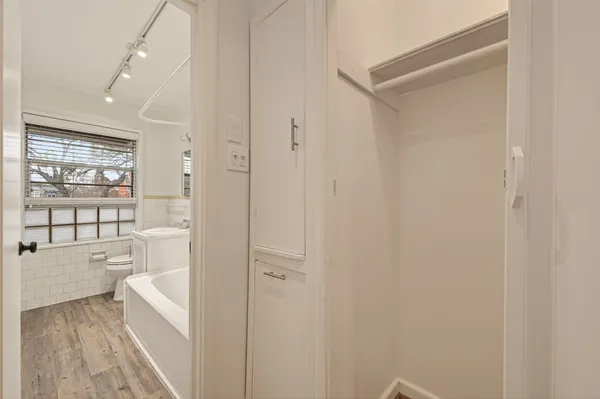 a bathroom with a bathtub and a shower