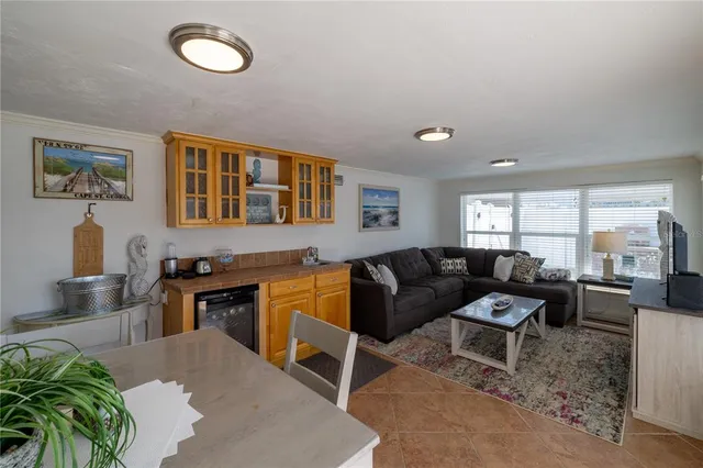 a living room with furniture window and wooden floor