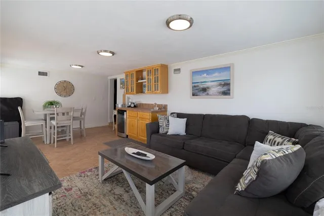 a living room with furniture and a rug