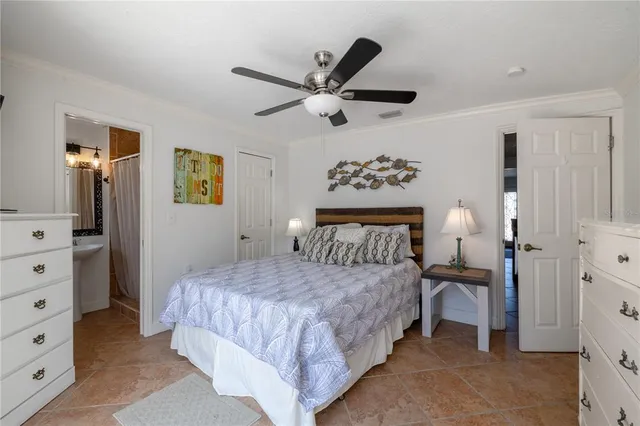 a bedroom with a bed and a dresser