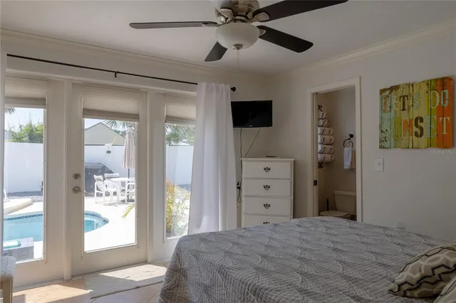 a bedroom with a large bed and a window