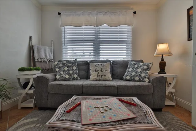 a living room with furniture and a window