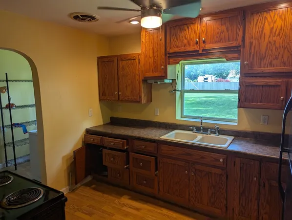 a kitchen with a sink and a window