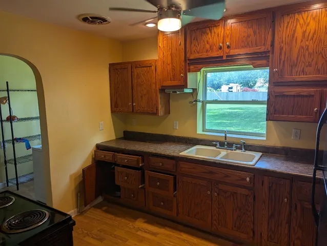 a kitchen with a sink and a window