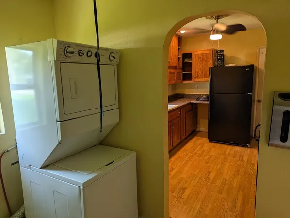 a kitchen with a refrigerator and a sink