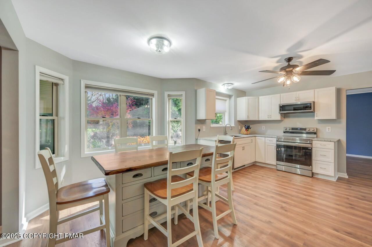 12 Kent Clarke Road Lake Harmony, PA 18624 - Photo 12 of 42 a view of a dining room with furniture window and wooden floor