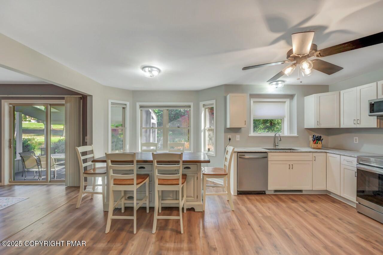 12 Kent Clarke Road Lake Harmony, PA 18624 - Photo 13 of 42 a view of a dining room with furniture window and wooden floor