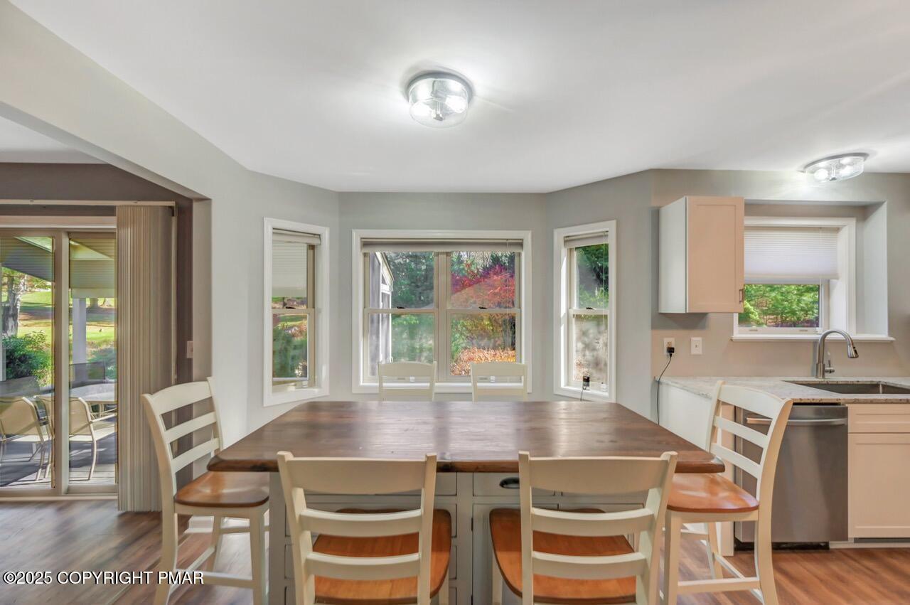 12 Kent Clarke Road Lake Harmony, PA 18624 - Photo 14 of 42 a view of a dining room with furniture window and wooden floor