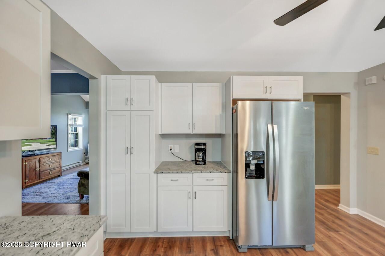 12 Kent Clarke Road Lake Harmony, PA 18624 - Photo 17 of 42 a kitchen with white cabinets and refrigerator