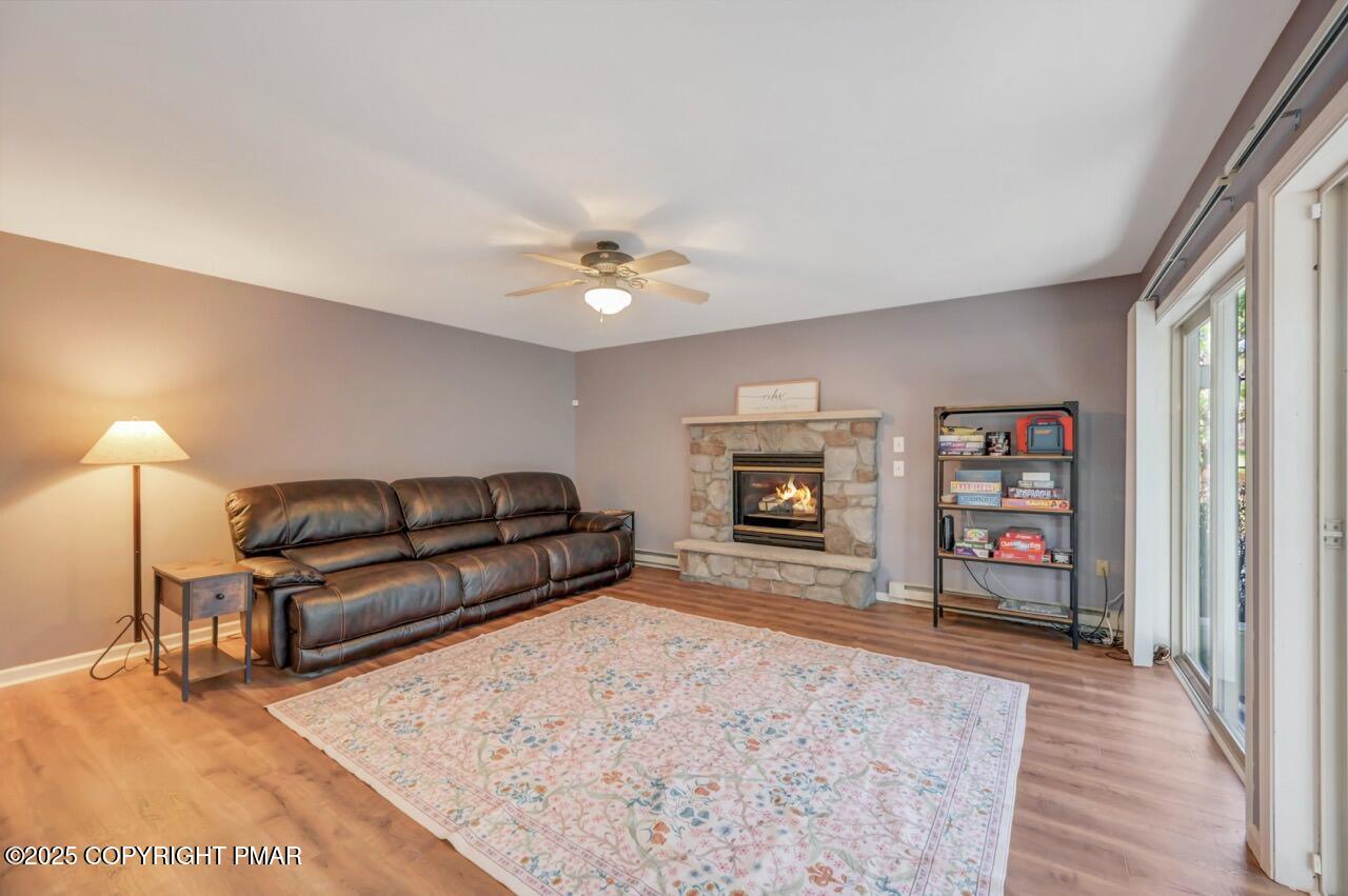 12 Kent Clarke Road Lake Harmony, PA 18624 - Photo 18 of 42 a living room with furniture and a fireplace
