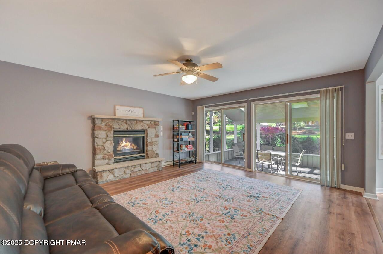 12 Kent Clarke Road Lake Harmony, PA 18624 - Photo 20 of 42 a living room with furniture a flat screen tv and a fireplace