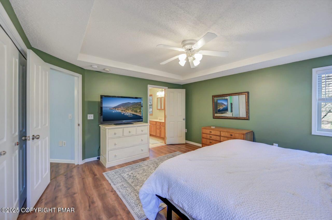 12 Kent Clarke Road Lake Harmony, PA 18624 - Photo 29 of 42 a bedroom with a bed and a flat screen tv