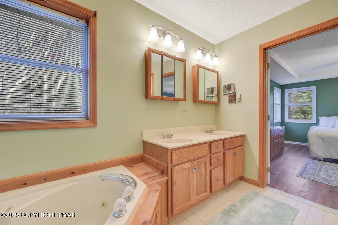 12 Kent Clarke Road Lake Harmony, PA 18624 - Photo 31 of 42 a bathroom with a sink and a mirror