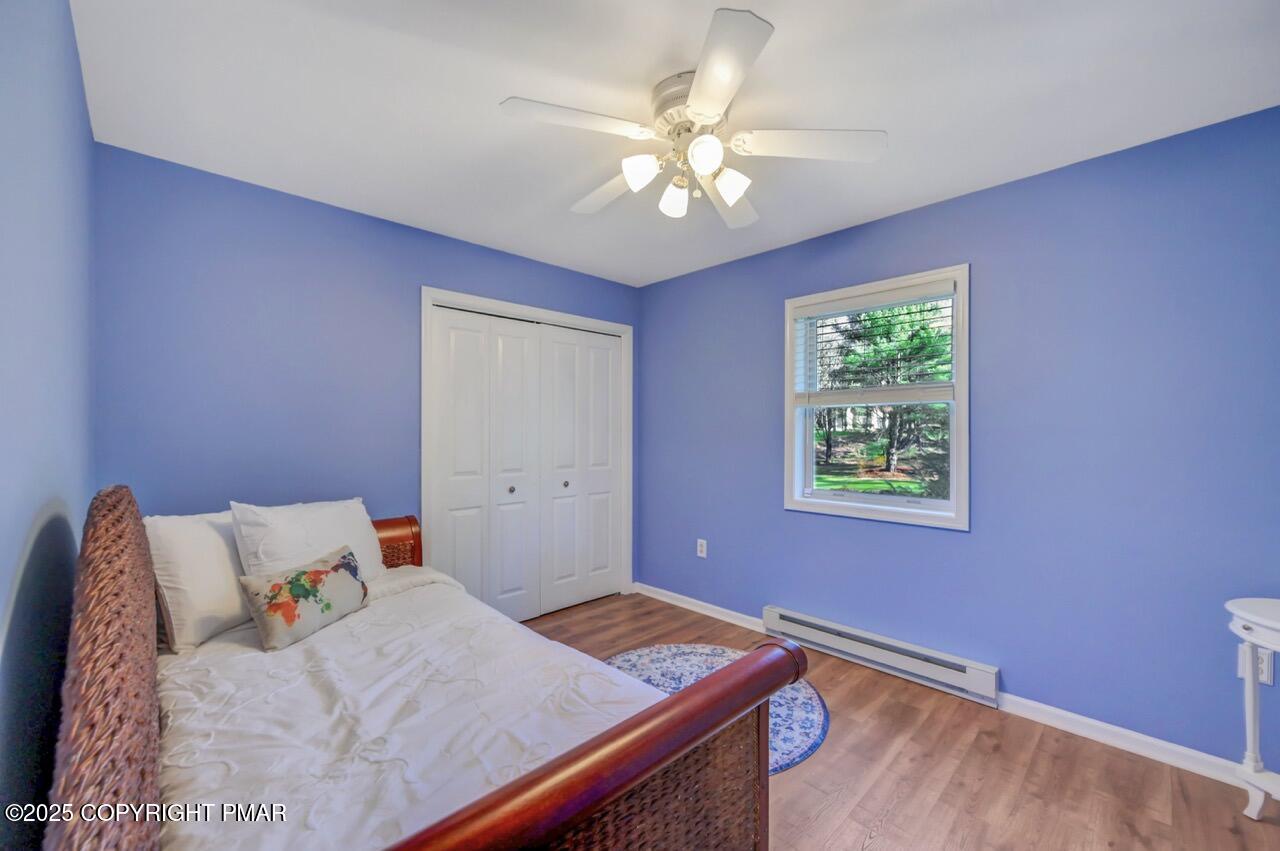 12 Kent Clarke Road Lake Harmony, PA 18624 - Photo 36 of 42 a bedroom with a bed and a chandelier