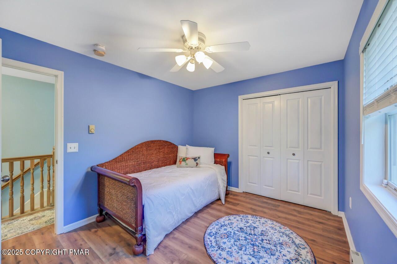 12 Kent Clarke Road Lake Harmony, PA 18624 - Photo 37 of 42 a bedroom with a bed and a chandelier