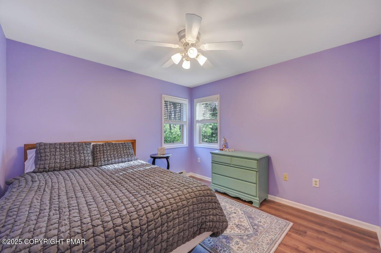 12 Kent Clarke Road Lake Harmony, PA 18624 - Photo 39 of 42 a bedroom with a bed and a chandelier