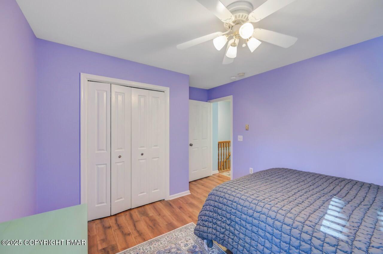 12 Kent Clarke Road Lake Harmony, PA 18624 - Photo 40 of 42 a bedroom with a bed chandelier and a window