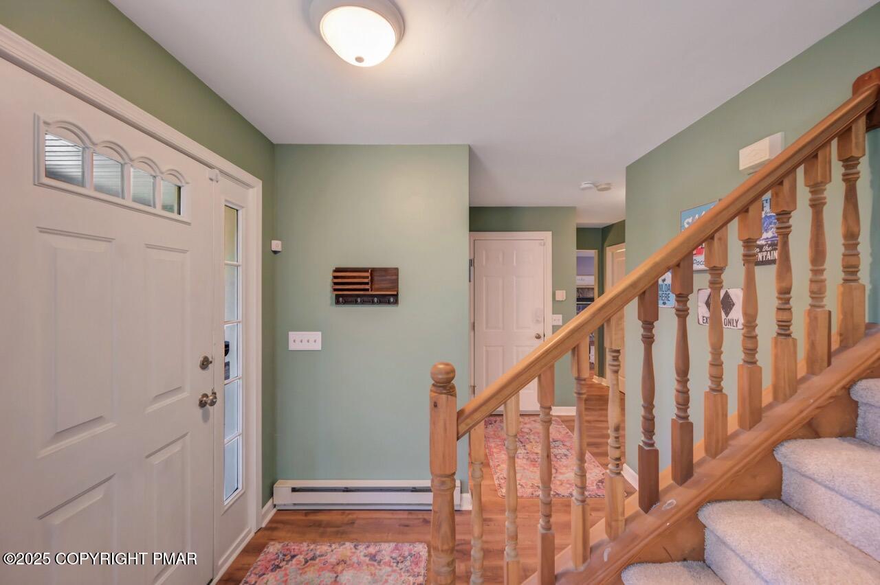 12 Kent Clarke Road Lake Harmony, PA 18624 - Photo 5 of 42 a view of staircase with lots of frames on wall and a window