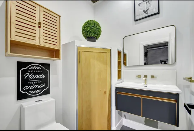 a bathroom with a sink and a mirror