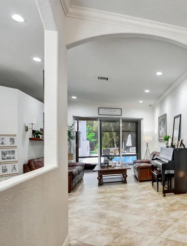 a living room with furniture and a large window