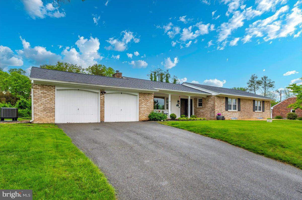 22019 Mohawk Drive Smithsburg, MD 21783 - Photo 1 of 60 a front view of a house with a yard and outdoor seating