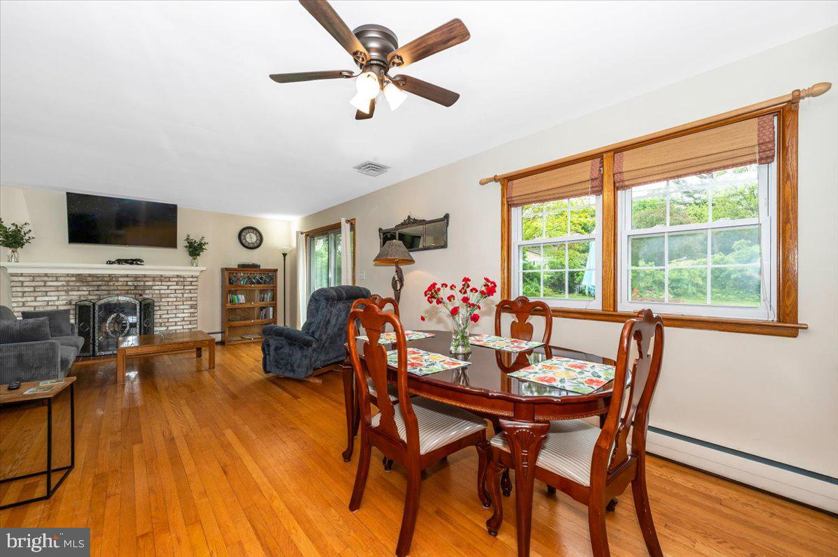 22019 Mohawk Drive Smithsburg, MD 21783 - Photo 11 of 60 a view of a dining room with furniture window and wooden floor