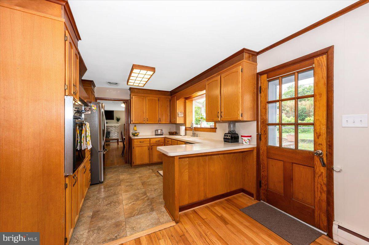 22019 Mohawk Drive Smithsburg, MD 21783 - Photo 12 of 60 a kitchen with a refrigerator and a sink