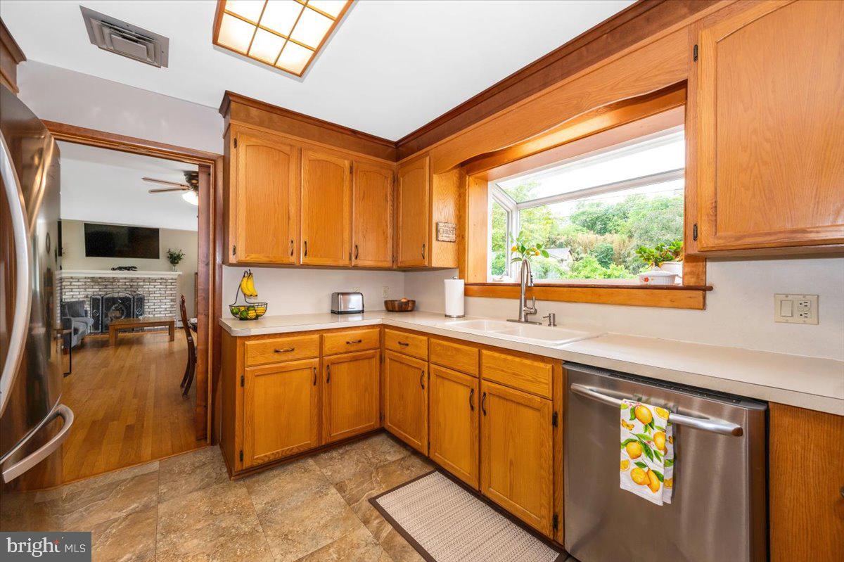 22019 Mohawk Drive Smithsburg, MD 21783 - Photo 15 of 60 a kitchen with stainless steel appliances granite countertop a sink and cabinets