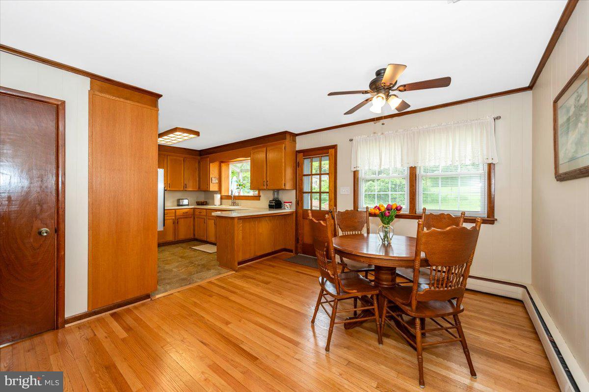 22019 Mohawk Drive Smithsburg, MD 21783 - Photo 20 of 60 a view of a dining room with furniture window and wooden floor
