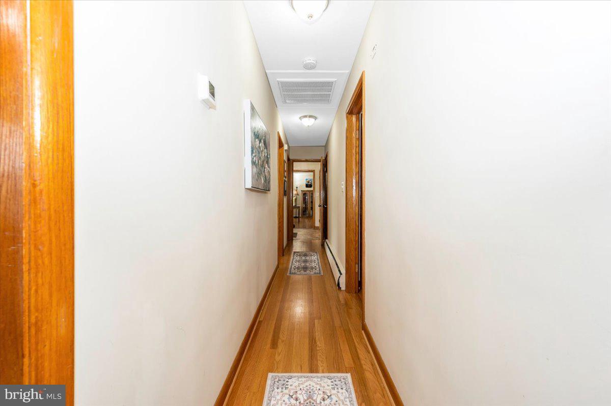 22019 Mohawk Drive Smithsburg, MD 21783 - Photo 23 of 60 a view of a hallway with wooden floor